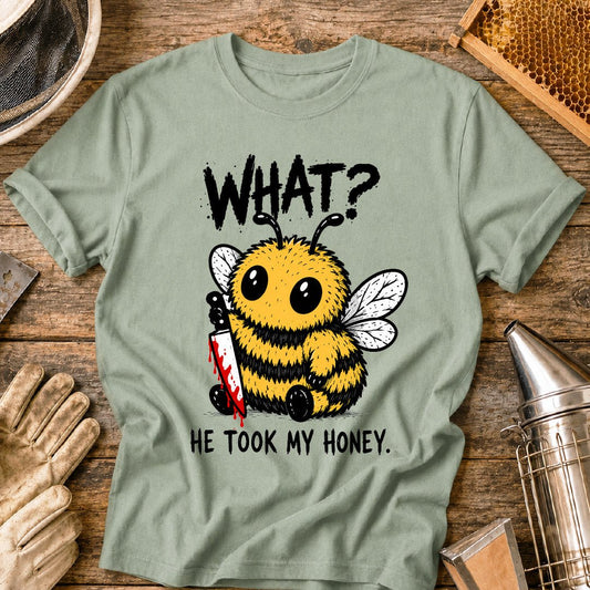 Funny beekeeper shirt design featuring a cute fluffy honey bee holding a bloody knife with the phrase “What? He Took My Honey,” a dark humor bee graphic for beekeepers and bee lovers.