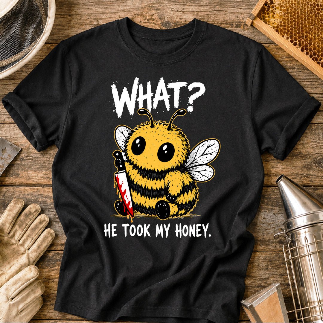 Funny beekeeper shirt design featuring a cute fluffy honey bee holding a bloody knife with the phrase “What? He Took My Honey,” a dark humor bee graphic for beekeepers and bee lovers.
