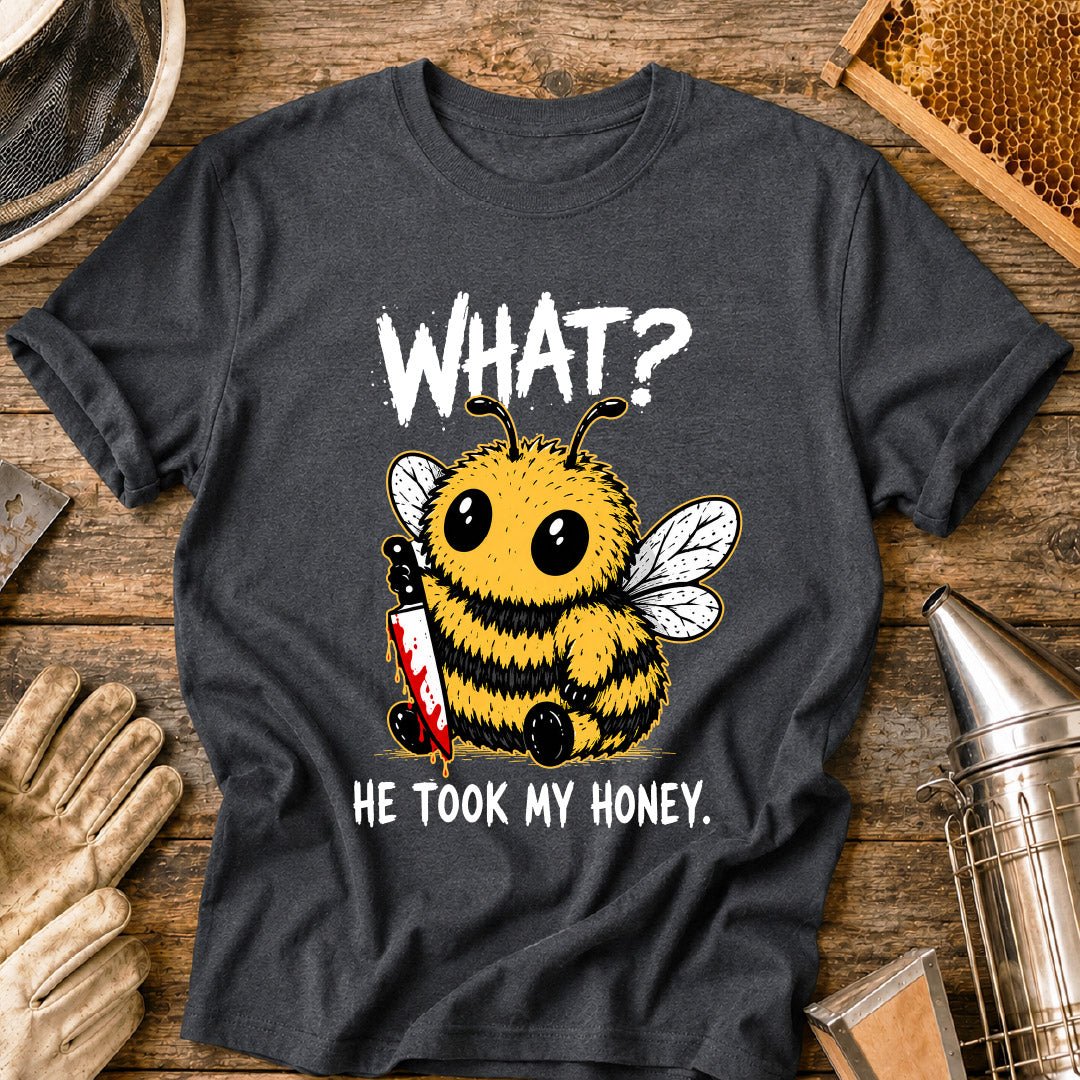 Funny beekeeper shirt design featuring a cute fluffy honey bee holding a bloody knife with the phrase “What? He Took My Honey,” a dark humor bee graphic for beekeepers and bee lovers.