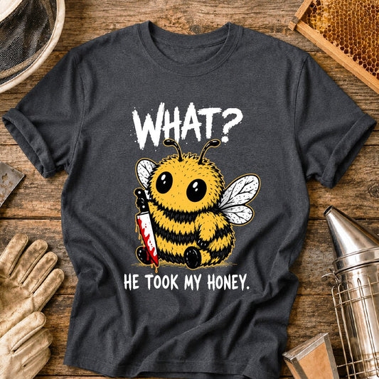 Funny beekeeper shirt design featuring a cute fluffy honey bee holding a bloody knife with the phrase “What? He Took My Honey,” a dark humor bee graphic for beekeepers and bee lovers.