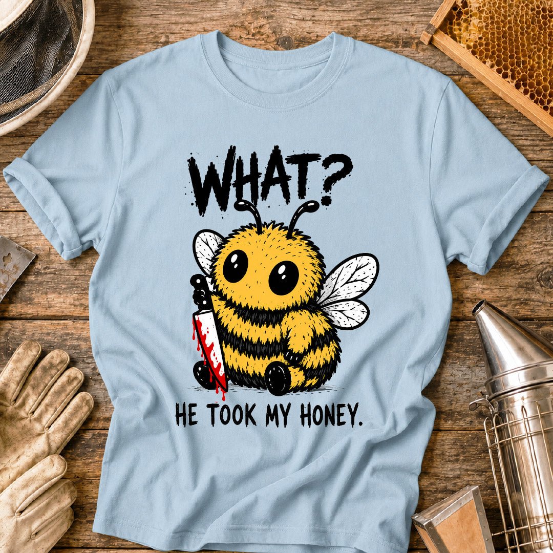 Funny beekeeper shirt design featuring a cute fluffy honey bee holding a bloody knife with the phrase “What? He Took My Honey,” a dark humor bee graphic for beekeepers and bee lovers.
