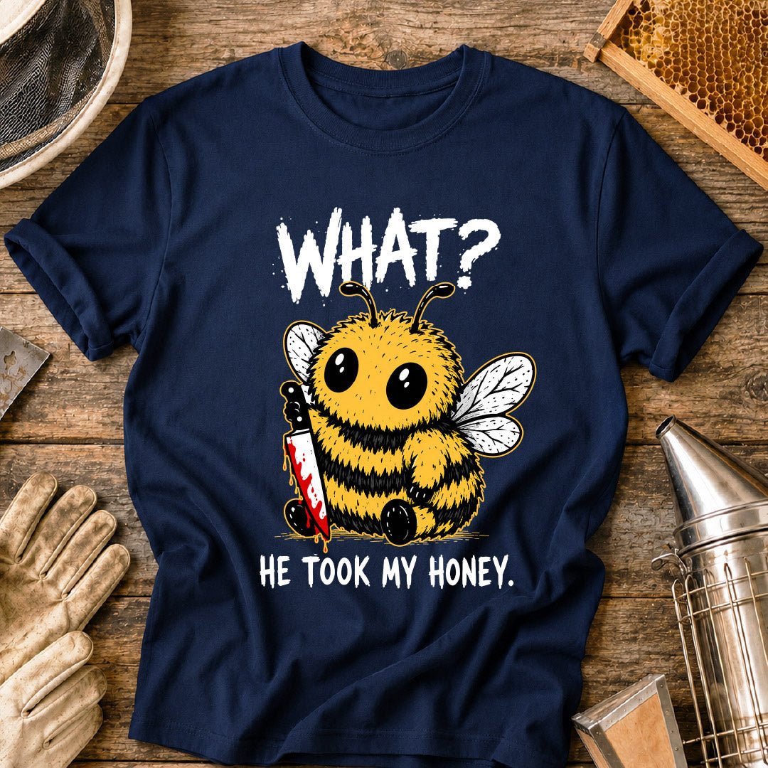Funny beekeeper shirt design featuring a cute fluffy honey bee holding a bloody knife with the phrase “What? He Took My Honey,” a dark humor bee graphic for beekeepers and bee lovers.